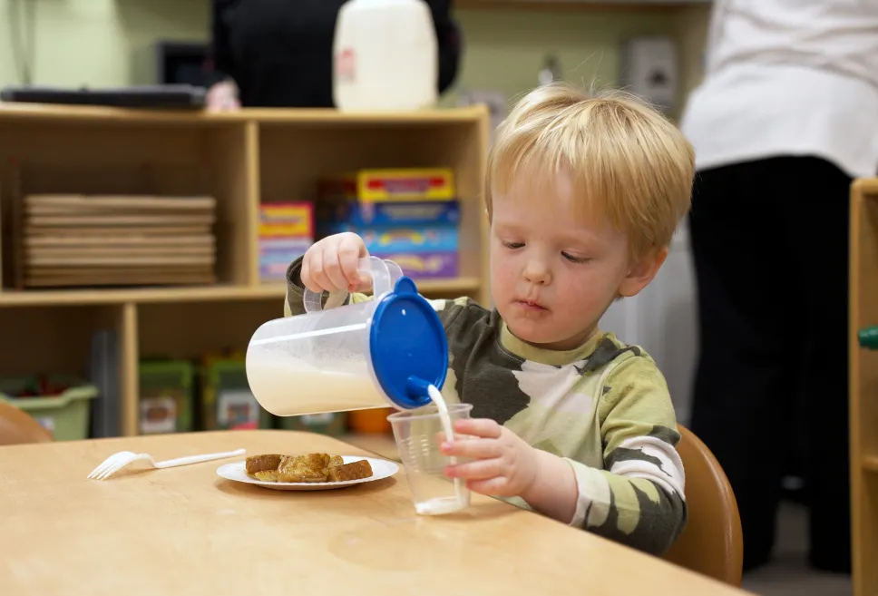Toddler Pouring Milk